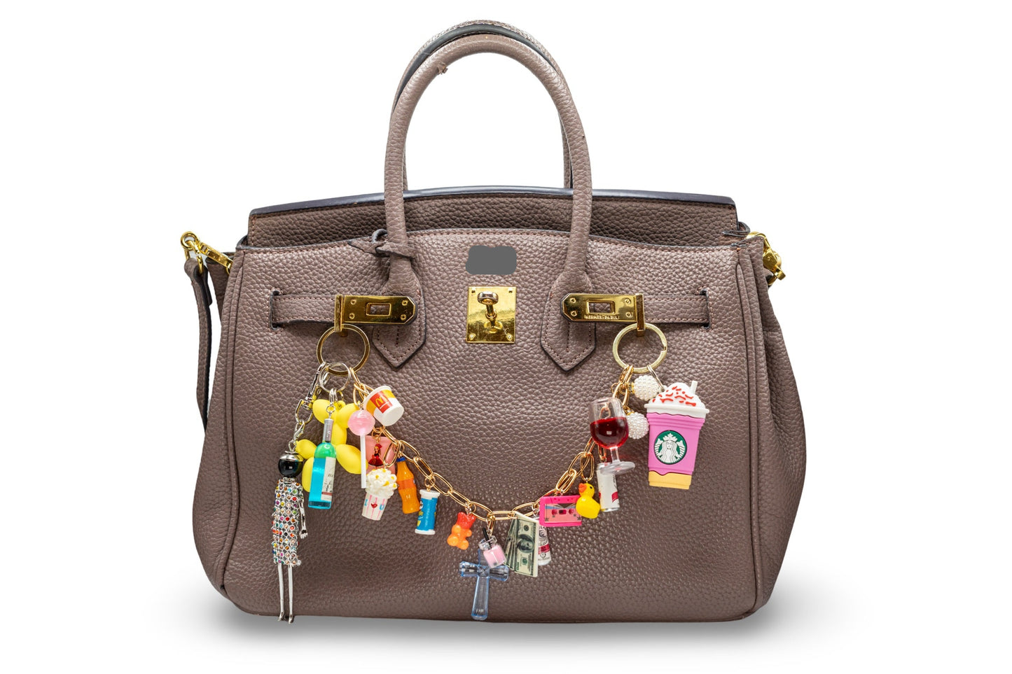 A brown bag with various custom-made chain charms attached to it, giving a sophisticated and personalized touch.