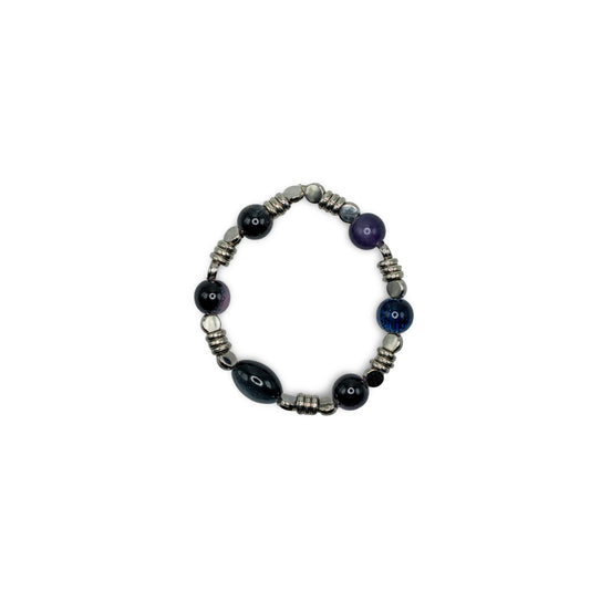 Beaded bracelet with black and silver beads on a white background